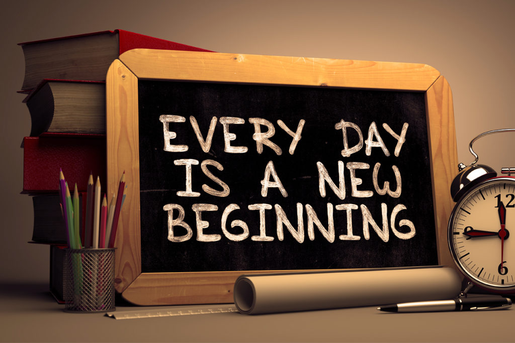 "every day is a new beginning" on a chalkboard.