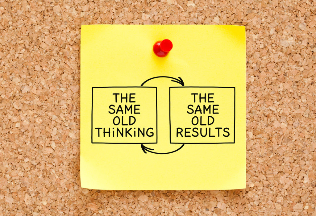 Slogan on corkboard : "same old thinking, same old results"