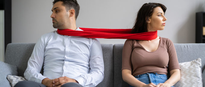 codependent couple on sofa