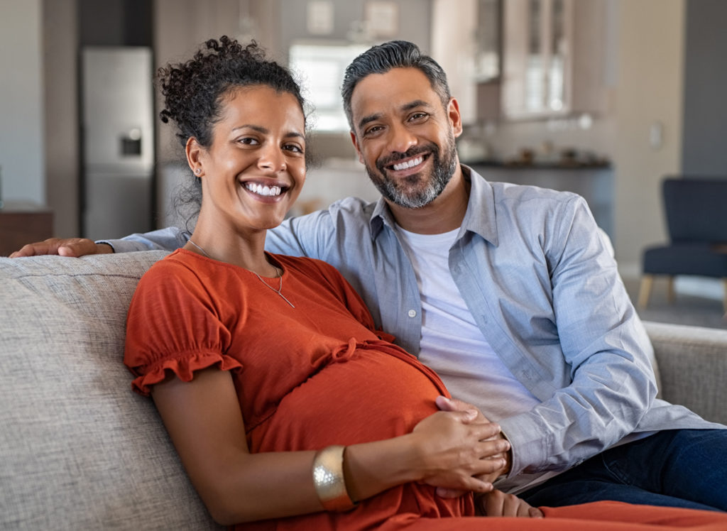 Couple. Preganant woman. Preparing for a baby.